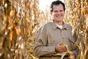 man-smiling-in-corn-fields