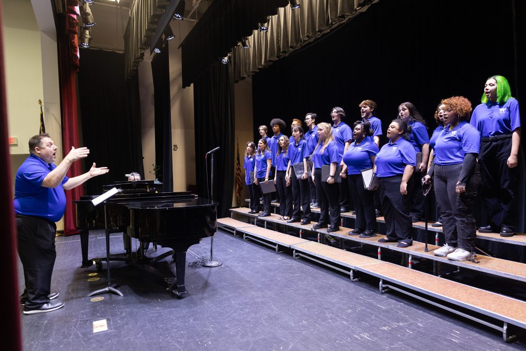 A man conducts a choir.