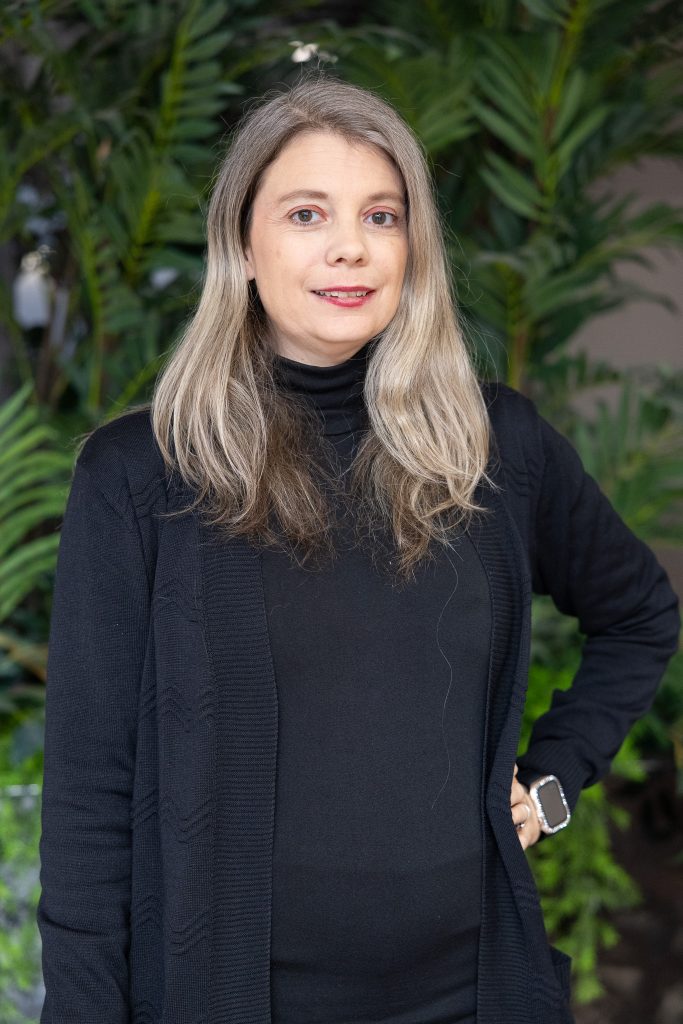 A woman is shown wearing a black shirt.