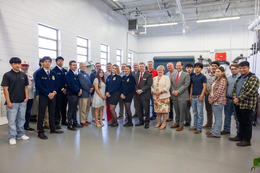 A group of people stand together.